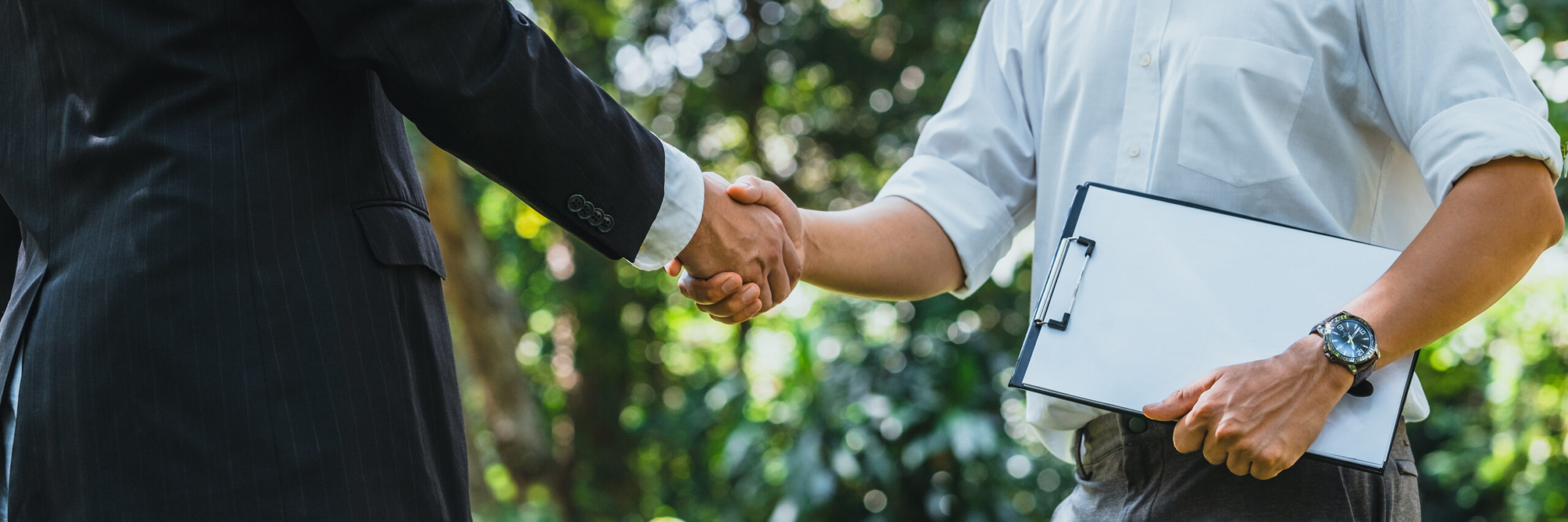 World Environment Day business partner colleagues shaking hands during a meeting working together in sustainability. Save Earth, World Environment Day concept, Earth Day.